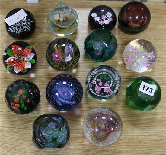 Fourteen glass paperweights including some Caithness